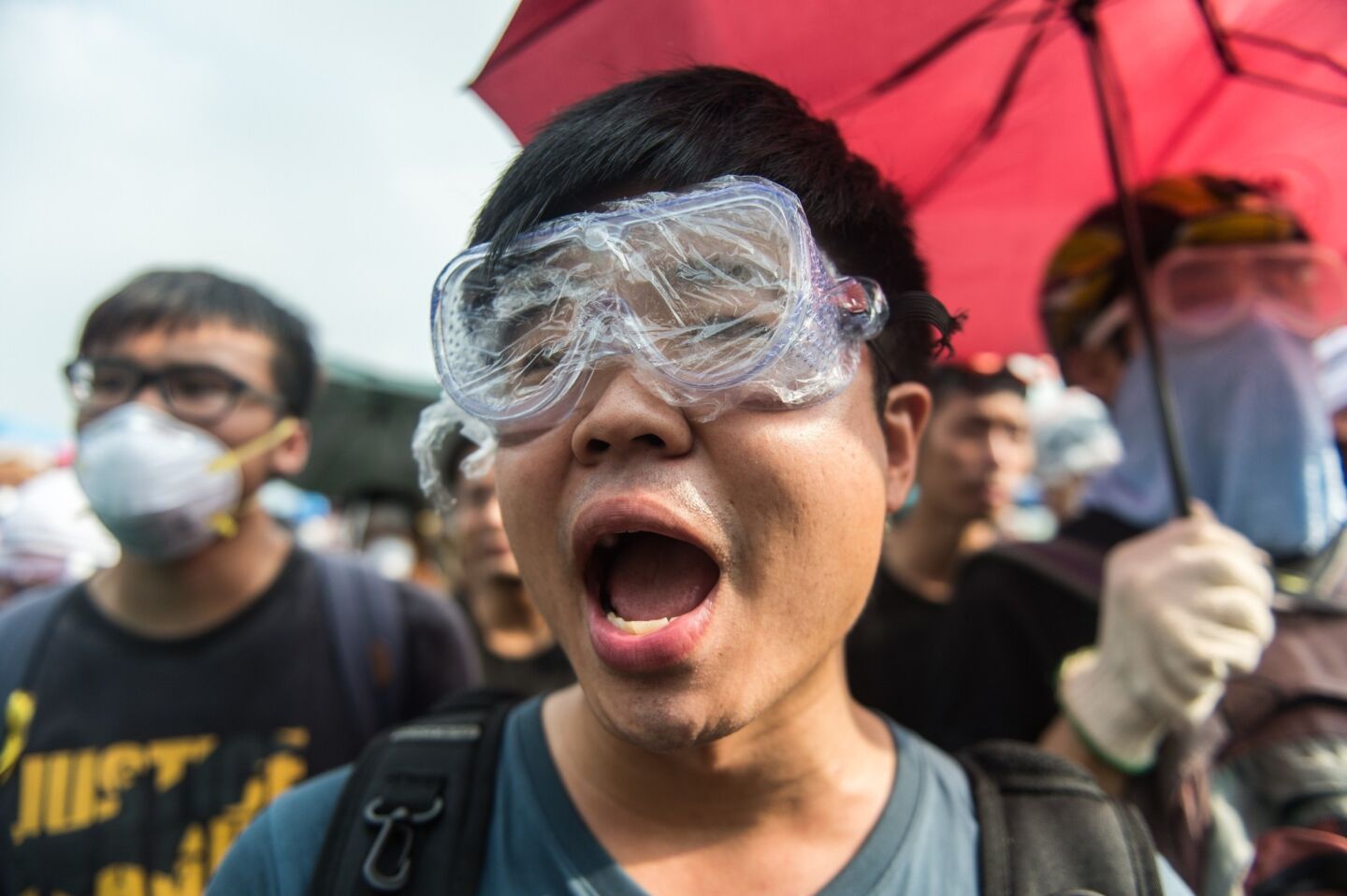Protesters shout slogans at police outside the government headquarters in Hong Kong.