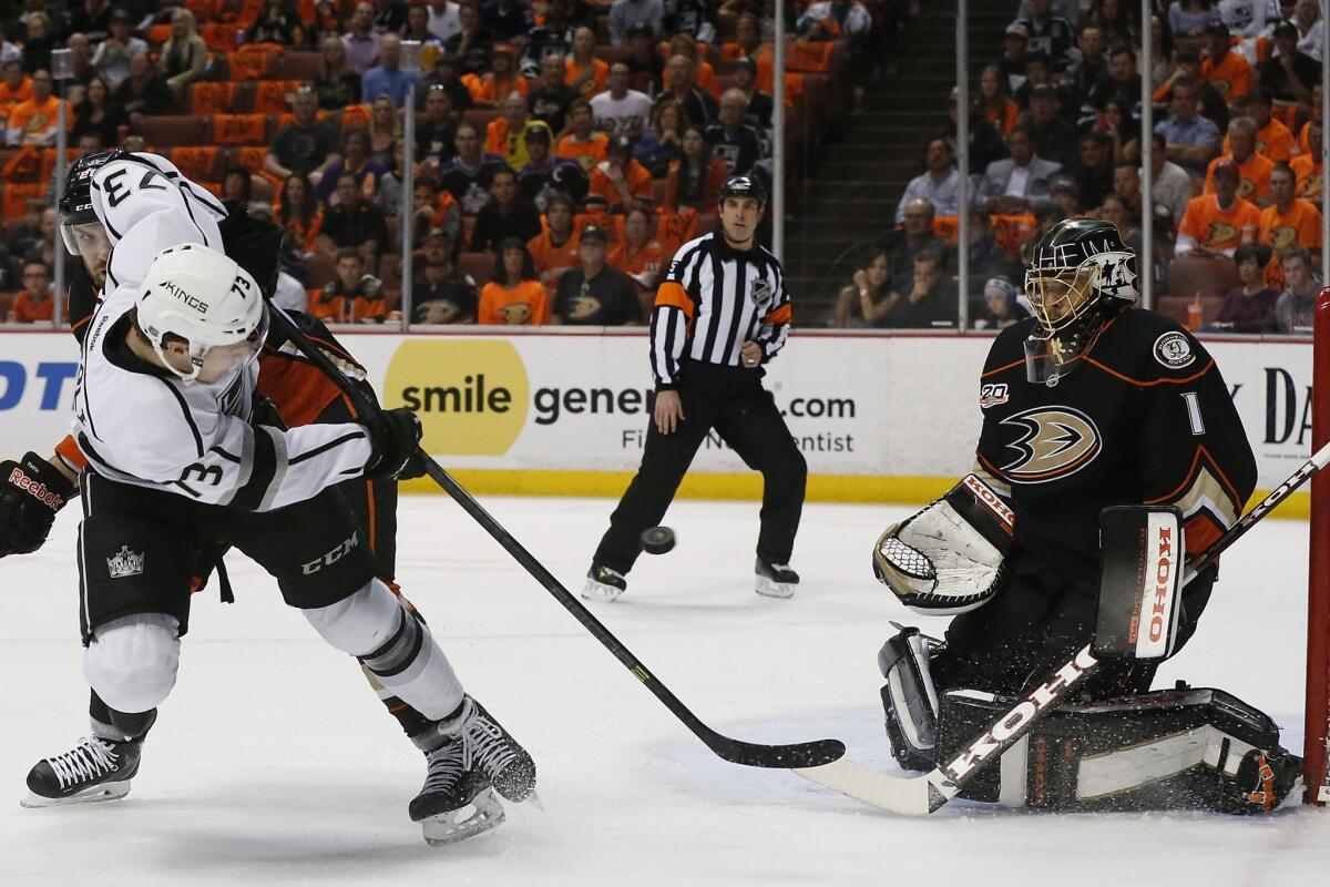 Ducks goalie Jonas Hiller, right, makes a save on a shot by Kings forward Tyler Toffoli in Game 1 of the Western Conference semifinals at Honda Center last week.