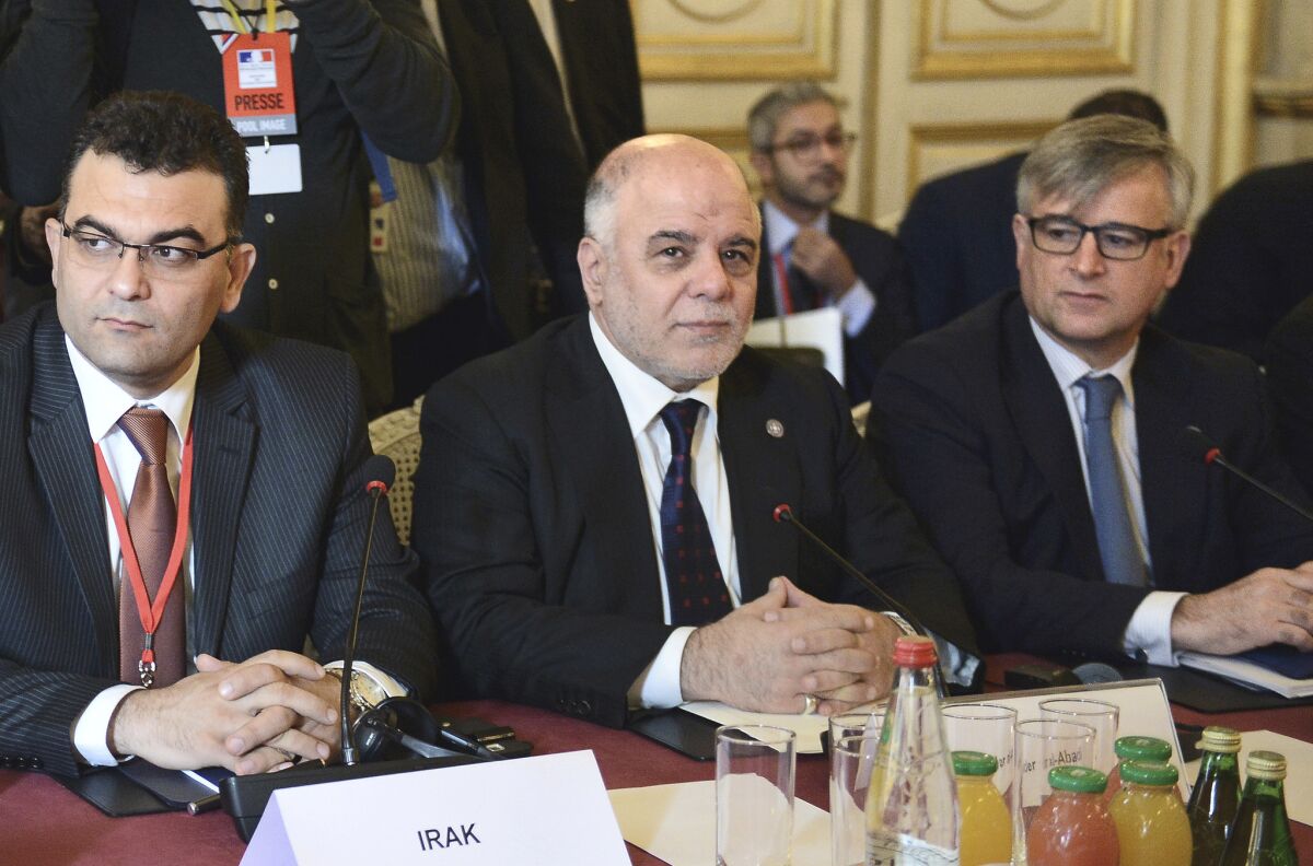 Iraqi Prime Minister Haider Abadi, center, and members of the anti-Islamic State coalition meet in Paris to discuss strategy on June 2.