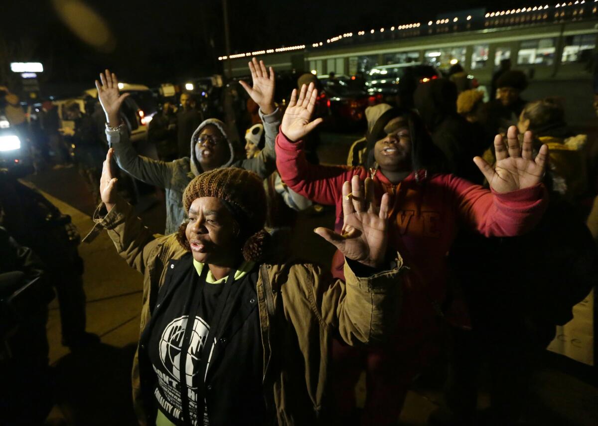 Protesters in Ferguson, Mo., on Monday, before the announcement by a grand jury over whether Officer Darren Wilson will face trial in the Aug. 9 killing of Michael Brown.