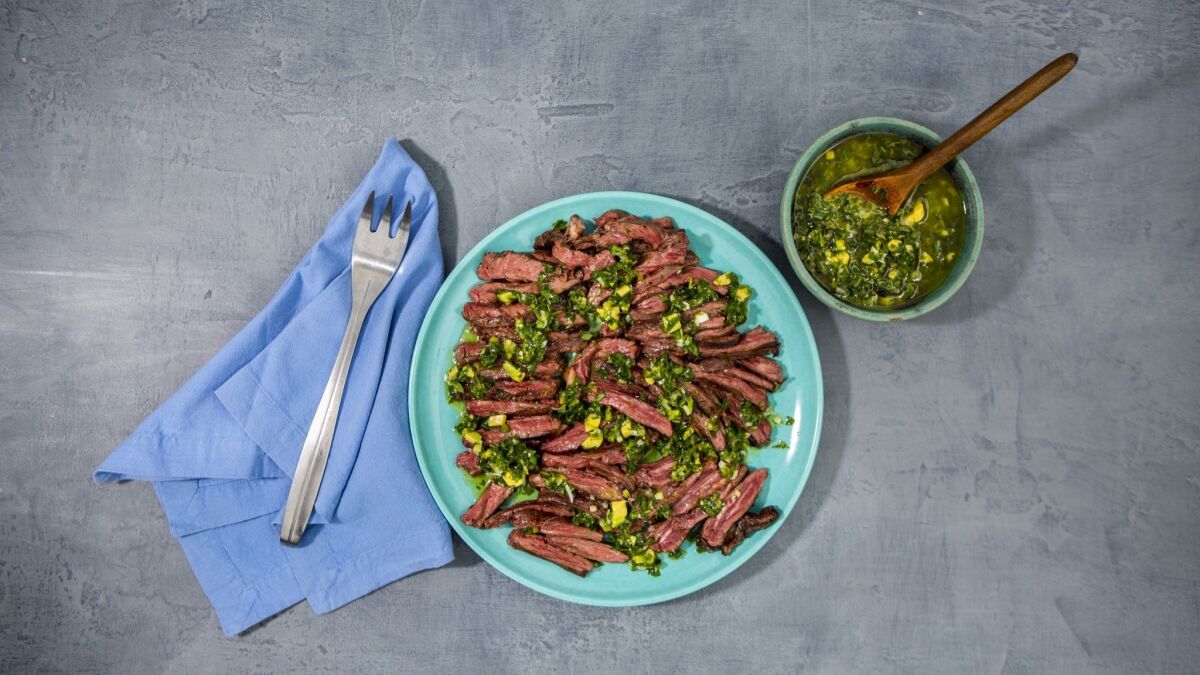 Skirt steak is seasoned simply with salt and pepper and served with a salsa made with fresh marjoram and lots of lime juice.