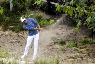 Co-leader Ricky Fowler hits out of the sandy rough on the 9th hole during the first round of the U.S. Open.