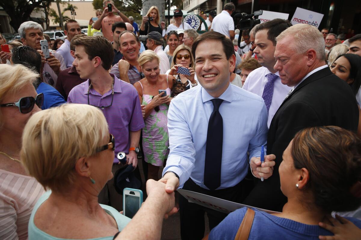 Sen. Marco Rubio of Florida, pushing to win his home state in the Republican presidential contest, greets supporters in Naples on Friday.