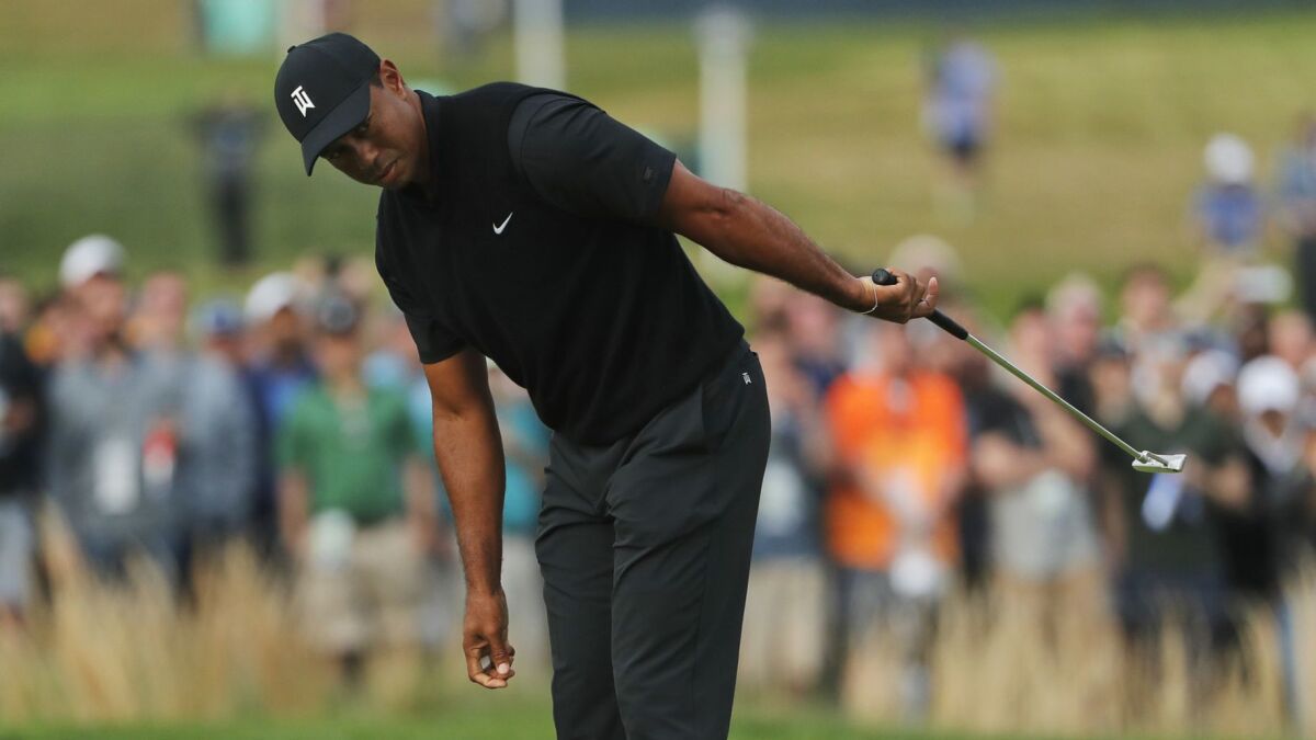 Tiger Woods reacts as he misses a putt on the 17th green during the second round of the PGA Championship on May 17.