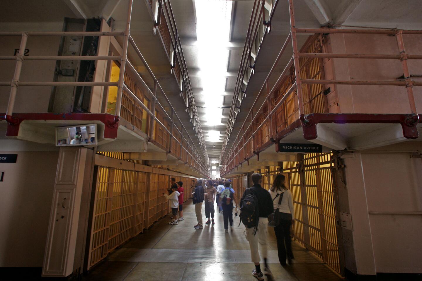 Visitors check out cells at Alcatraz, once home to a federal prison. Great city views are had on the boat ride over to the island in San Francisco Bay.