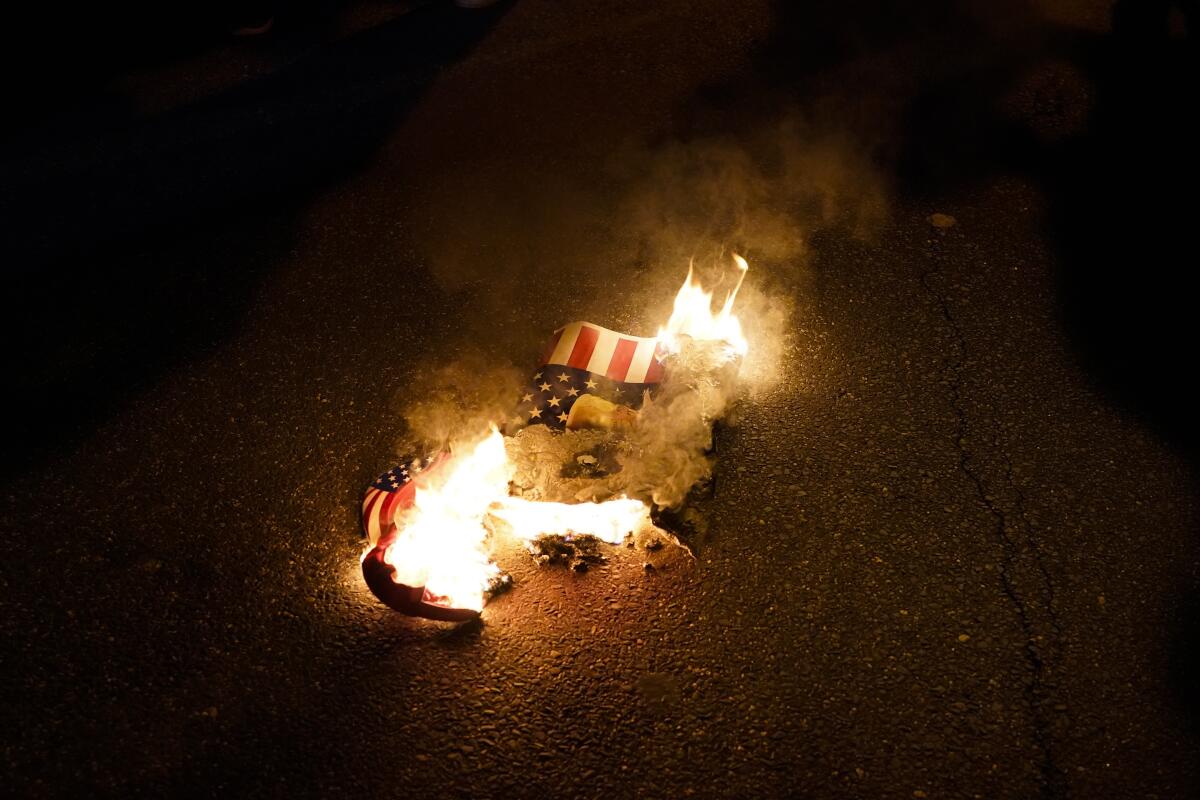 Burning protest sign