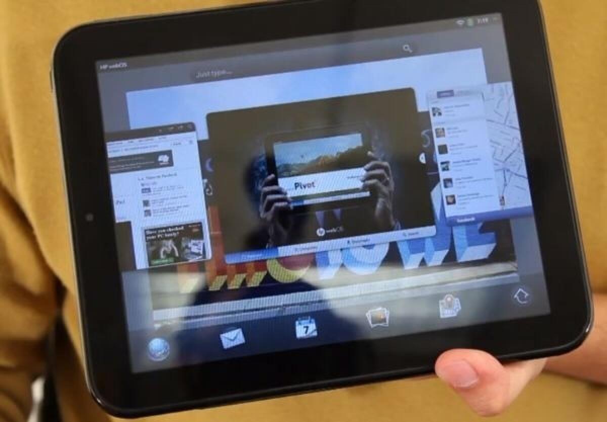 An HP TouchPad tablet running apps on the WebOS operating system.