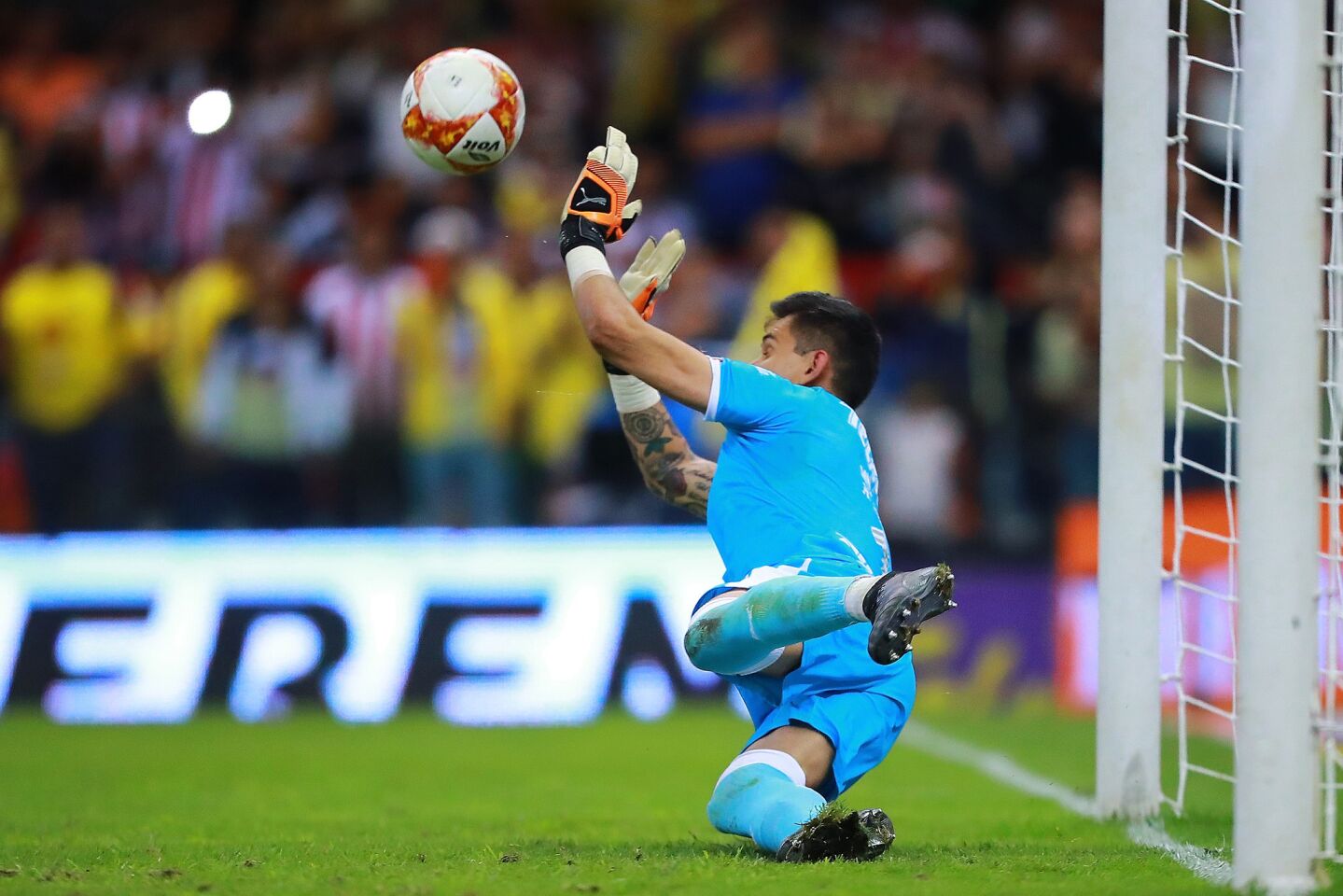 Raul Gudiño #1 of Chivas stops a penalty kick during the 11th round match between America and Chivas as part of the Torneo Apertura 2018 Liga MX at Azteca Stadium on September 30, 2018 in Mexico City, Mexico.