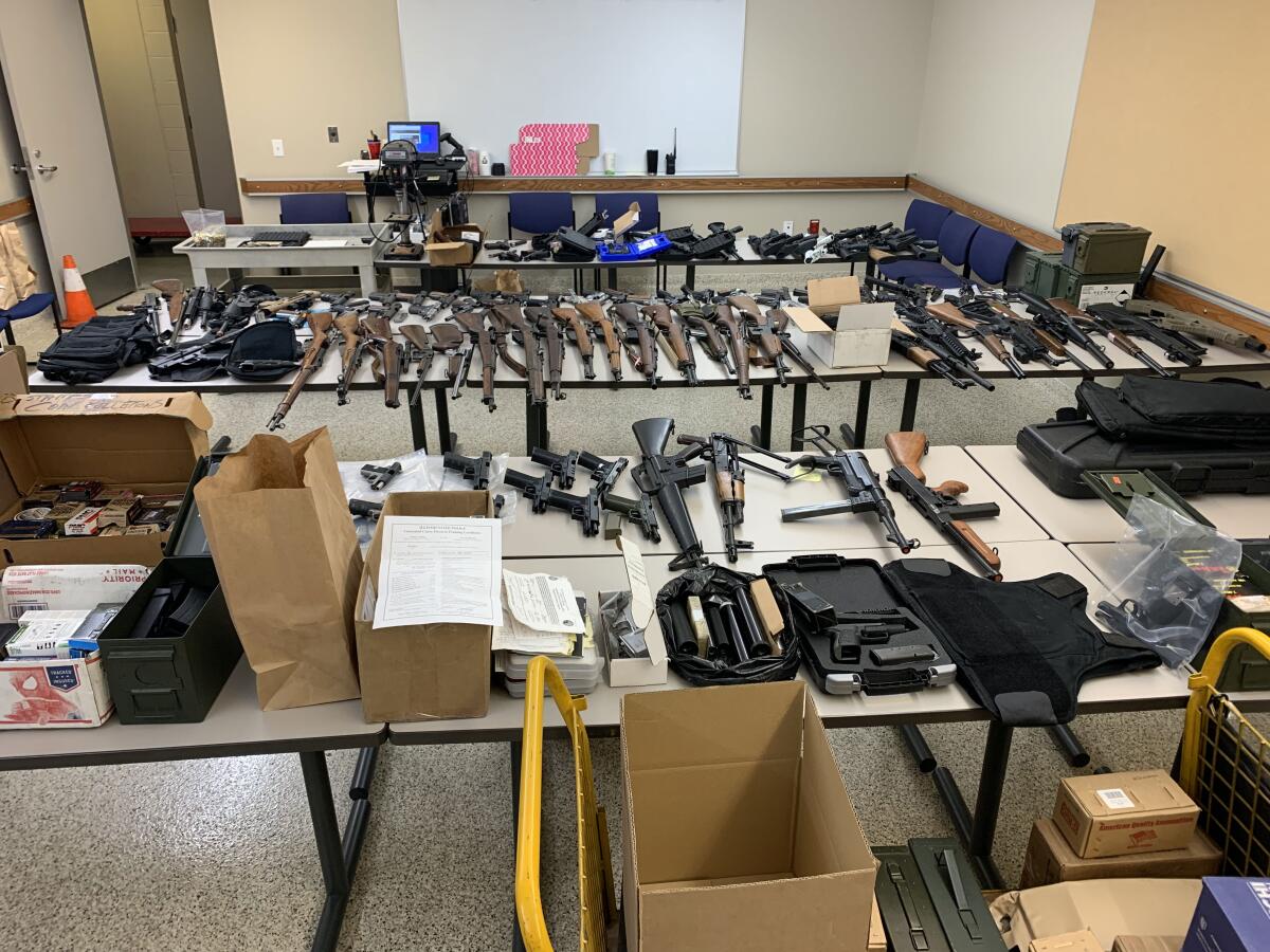 Dozens of guns on tables