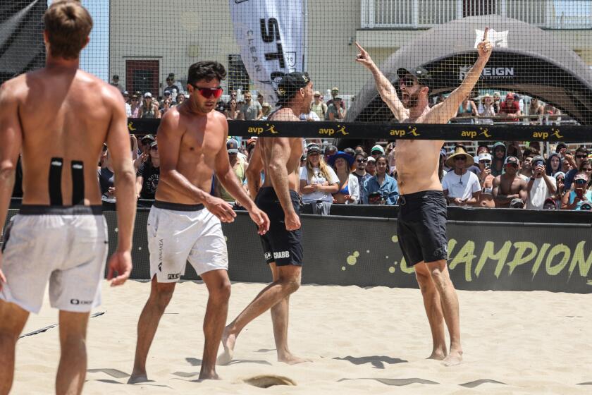 Hermosa Beach, CA, Sunday, July 9, 2023 - Theo Brunner and Trevor Crabb, right, celebrate a victory over Taylor Crabb Taylor Sander the AVP Pro Series men's final. (Robert Gauthier/Los Angeles Times)