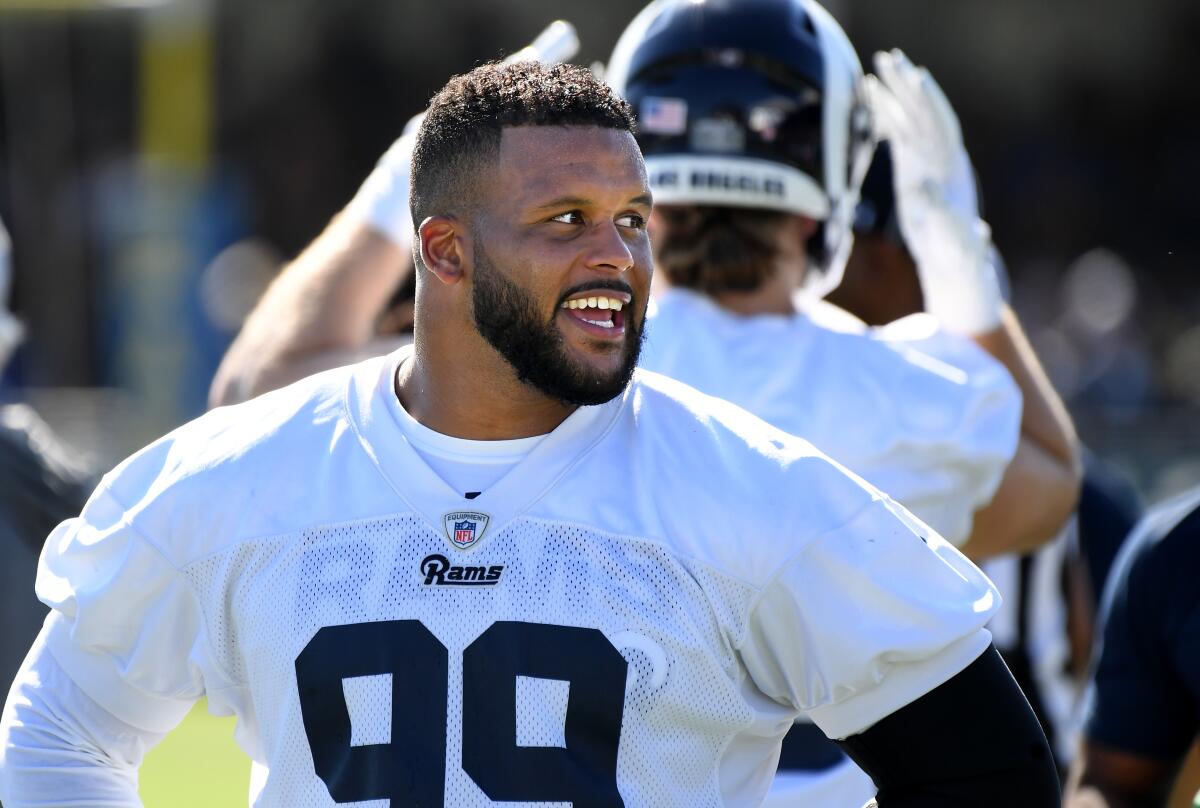 Rams defensive tackle Aaron Donald takes a break during the first day of training camp at UC Irvine on Saturday.