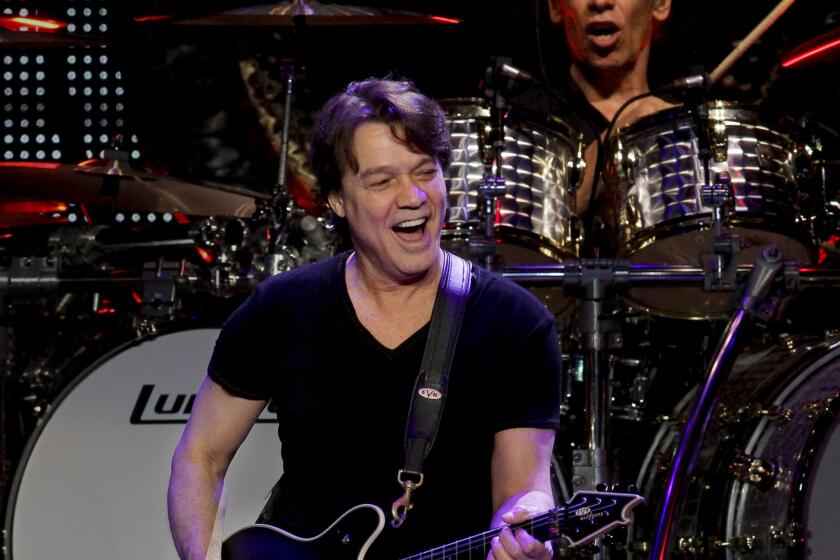 Cusack, Anne ?? B582137562Z.1 LOS ANGELES, CA. ? JUNE 1, 2012: Eddie Van Halen, left, and brother Alex Van Halen perform as Van Halen rocks at Staples Center on June 1, 2012 in Los Angeles. (Anne Cusack/Los Angeles Times)