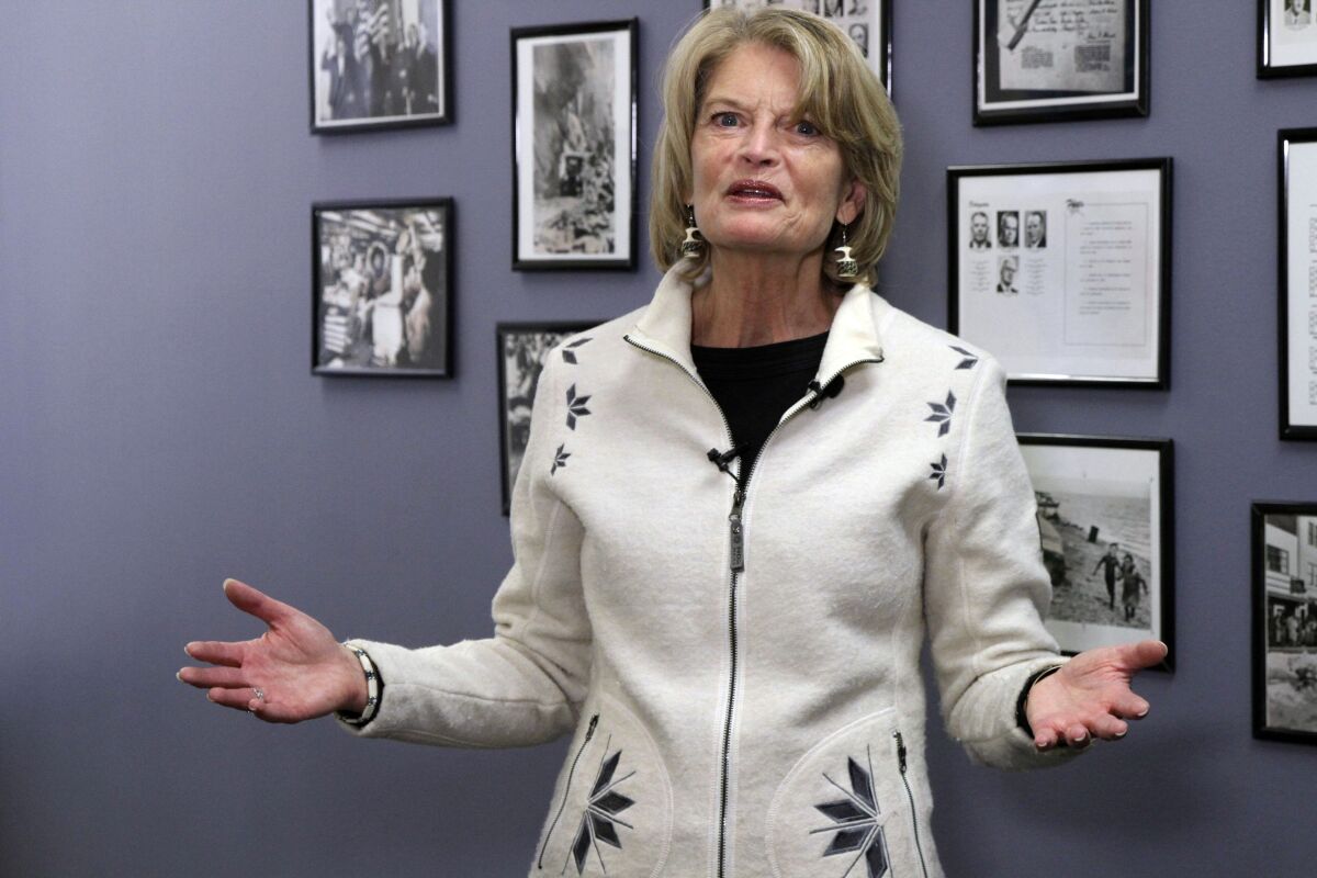 U.S. Sen. Lisa Murkowski, an Alaska Republican, speaks to reporters after filing for re-election Friday, Nov. 12, 2021, at the Division of Elections office in Anchorage, Alaska, setting up a race against a primary challenger endorsed by former President Donald Trump. (AP Photo/Mark Thiessen)