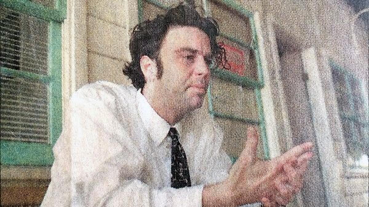 Richard Johnson, in a March 1998 photo in the Daily Pilot, discusses the 1997 death of his girlfriend, Adrienne "Sunny" Sudweeks.