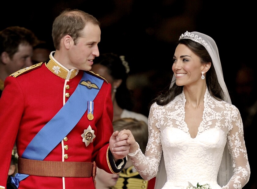 Prince William and the Duchess of Cambridge stand outside Westminster Abbey after their royal wedding.