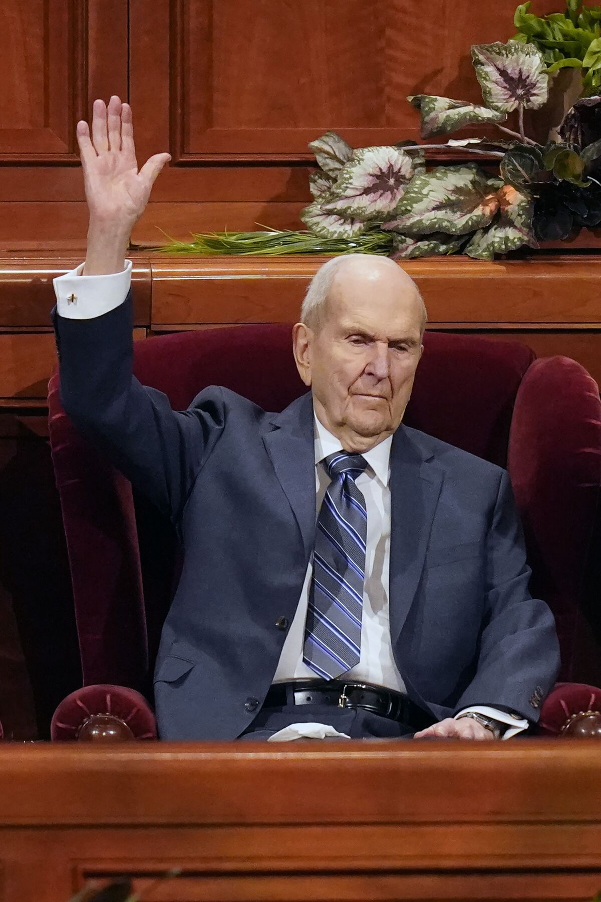 FILE - President Russell M. Nelson raises his hand during a sustaining vote during The Church of Jesus Christ of Latter-day Saints' twice-yearly conference Saturday, April 2, 2022, in Salt Lake City. The president of the The Church of Jesus Christ of Latter-day Saints became the faith's oldest leader in history on Tuesday, April 12, 2022 at 97 years, seven months and six days. (AP Photo/Rick Bowmer, File)