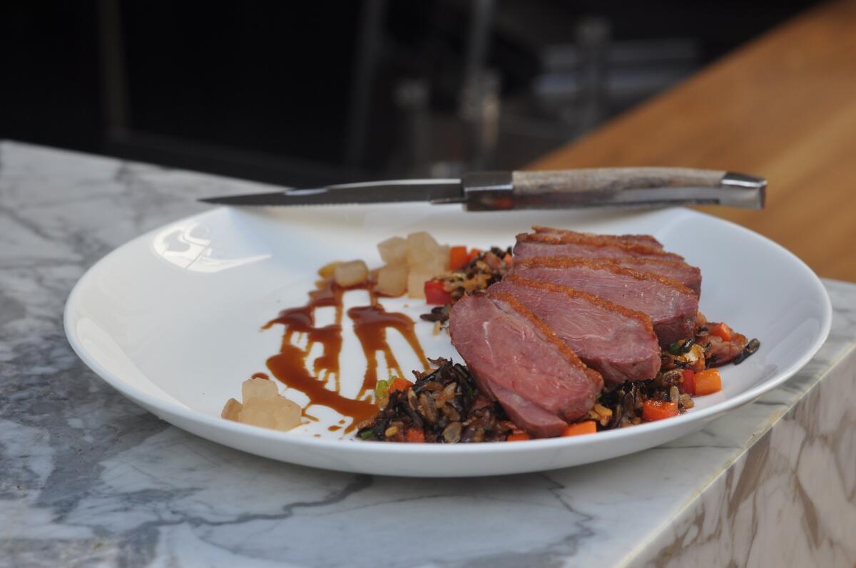 Aged Liberty Farms duck with wild rice, pear and XO sauce