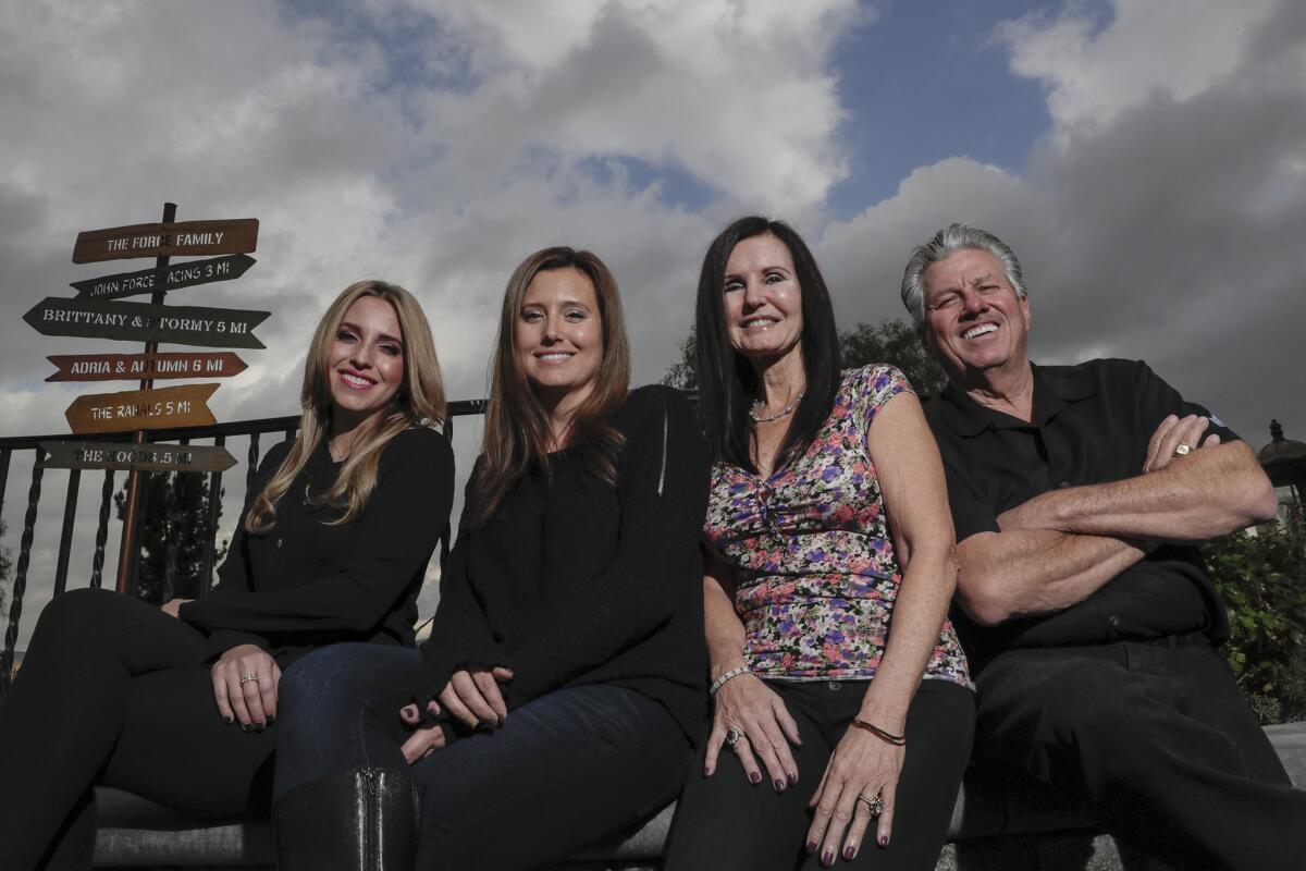 From left, Brittany, Ashley, Laurie and John Force pose at the family compound in Yorba Linda.