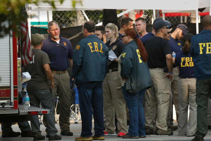 FBI investigators gather Monday morning outside the Pulse nightclub.