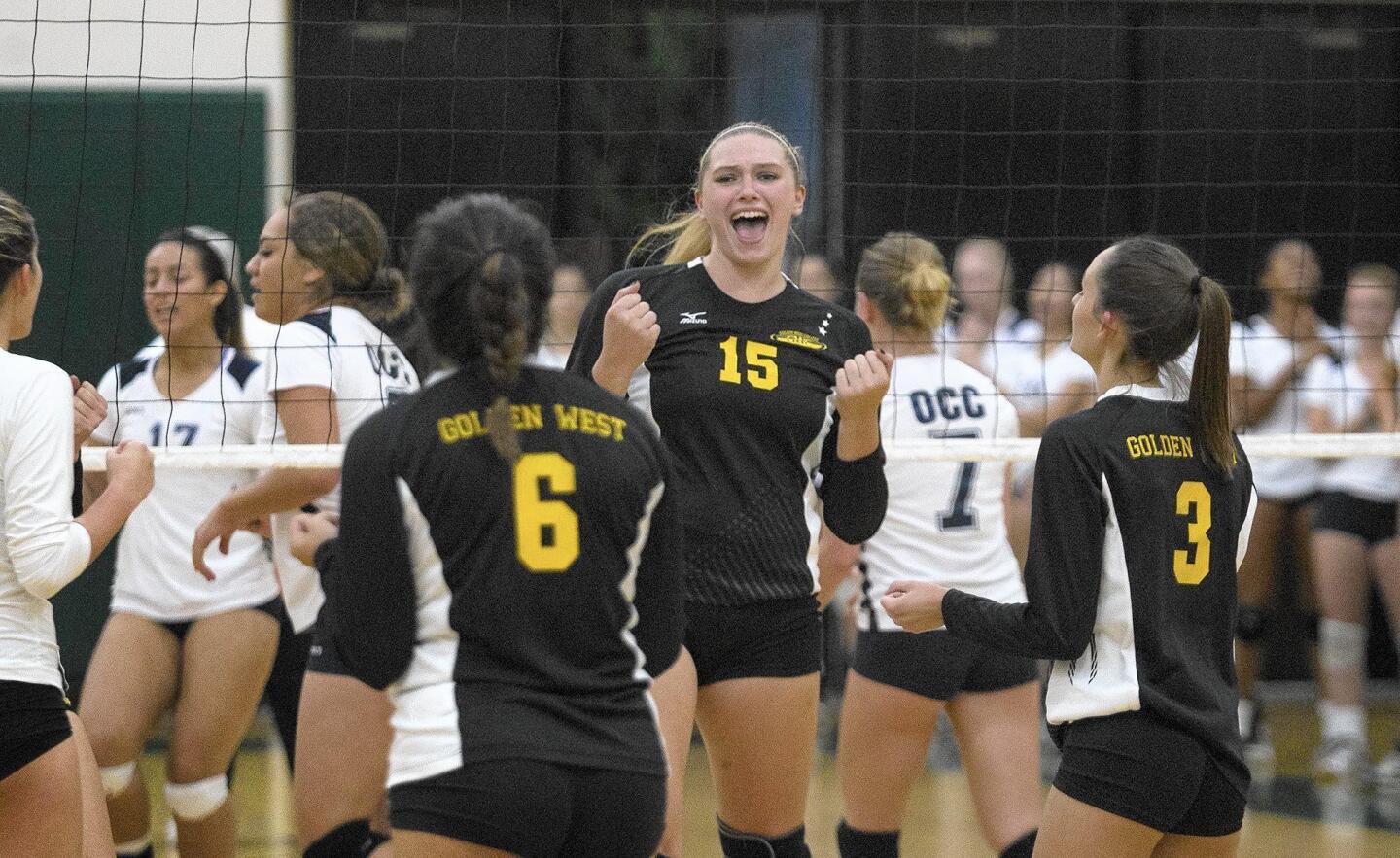 Golden West College's Cassidy Paperny (15) cheers after scoring a point during the second set against Orange Coast College on Wednesday.