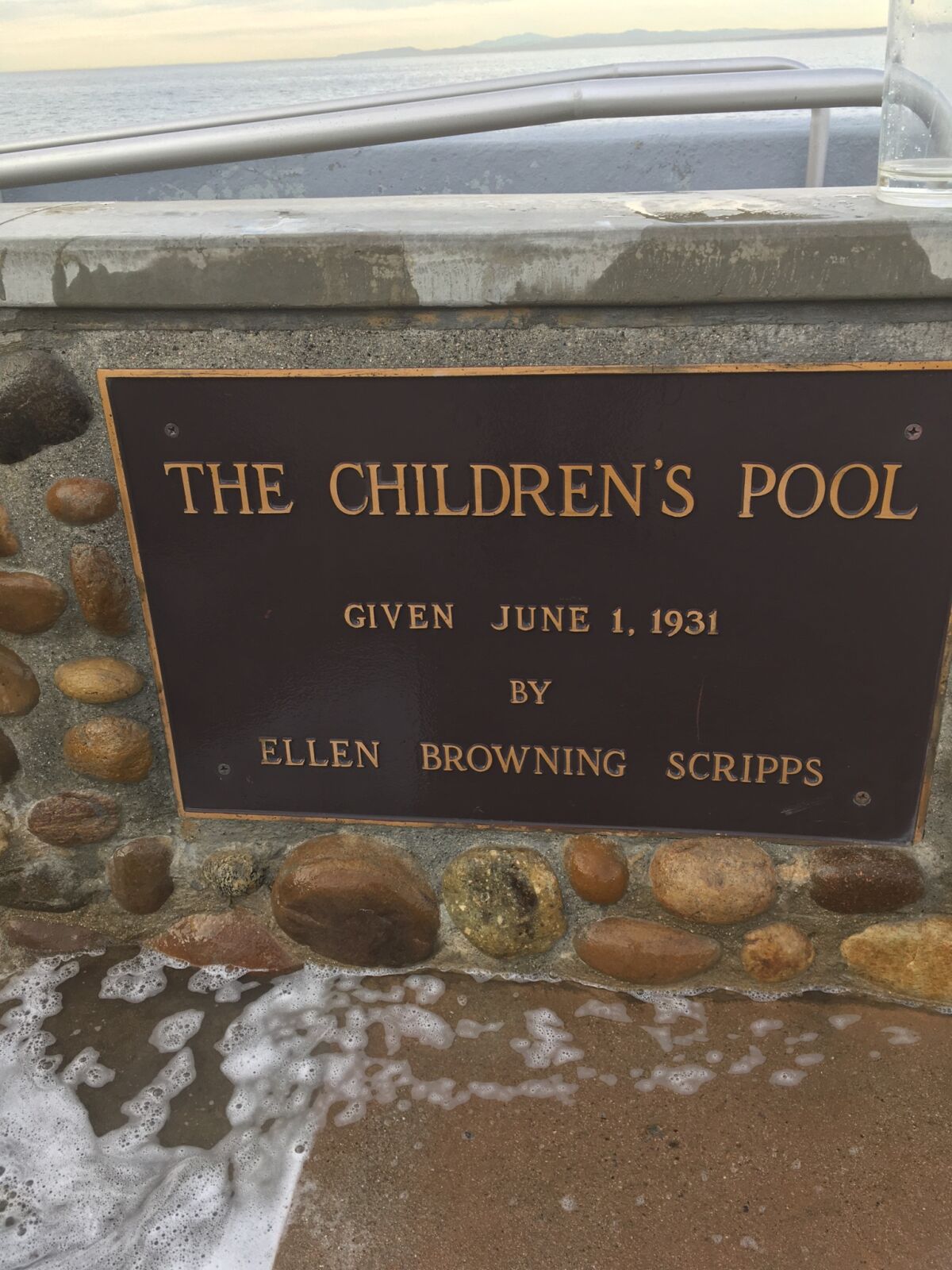 The Children's Pool plaque after it was cleaned.