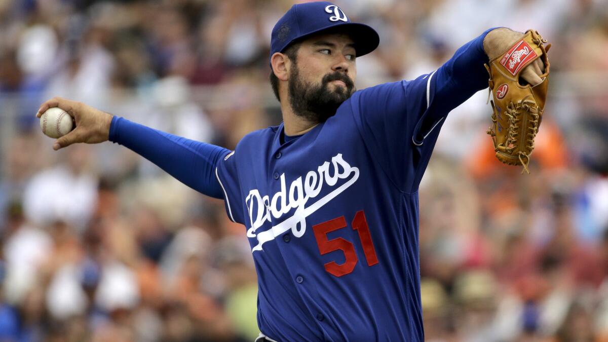 Dodgers starter Zach Lee delivers a pitch against the Giants in the first inning of a preseason game March 6.