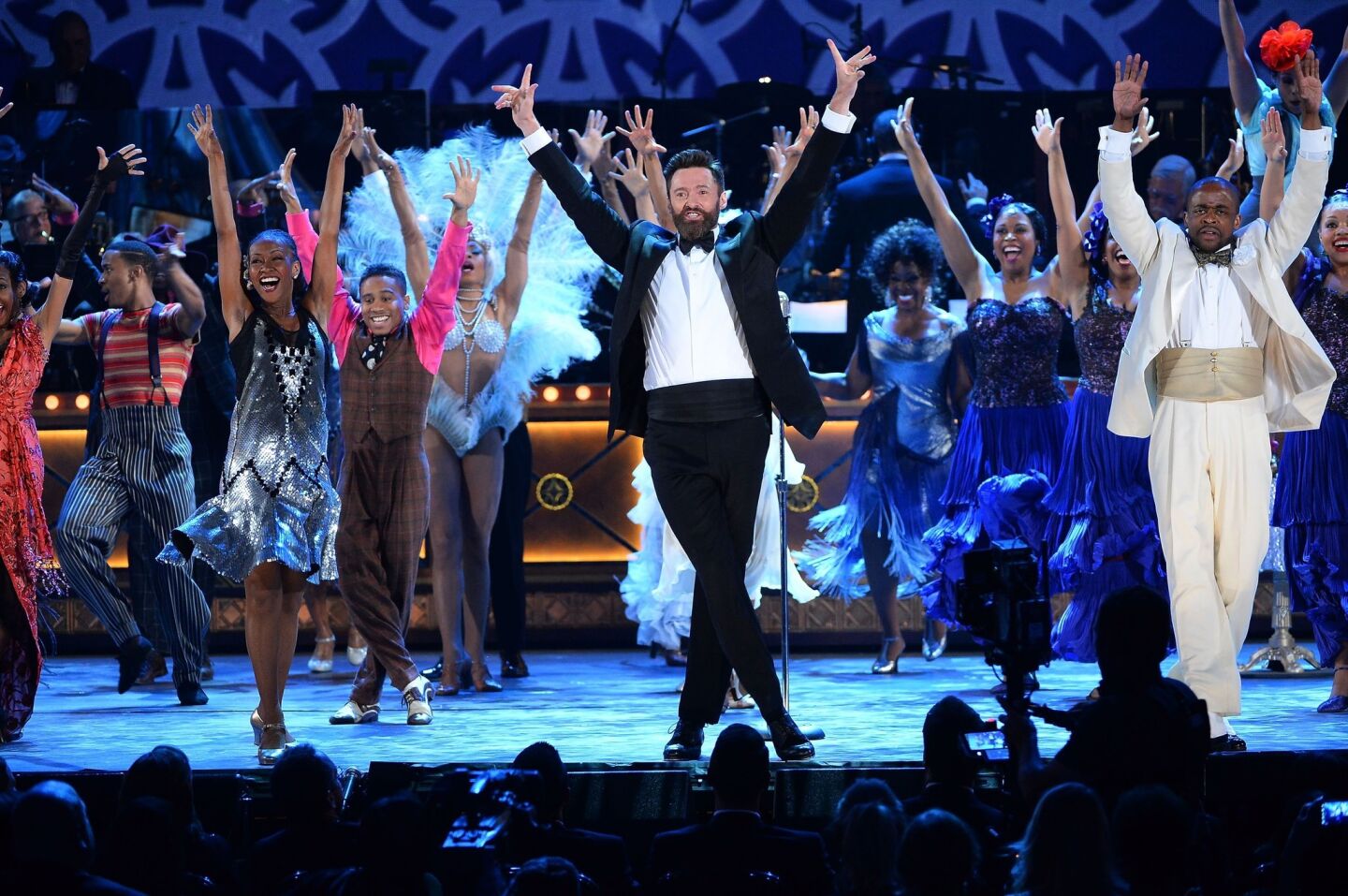 Aussie actor and host of the evening Hugh Jackman, center, and the cast of "After Midnight" perform.