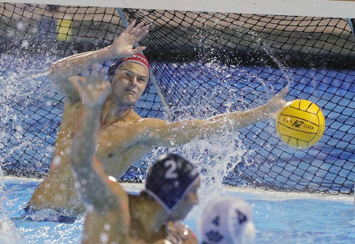 Newport Harbor goalkeeper Blake Jackson blocks a Loyola shot late in the CIF Southern Section Division 1 semifinal playoff match at Woollett Aquatics Center in Irvine on Wednesday.