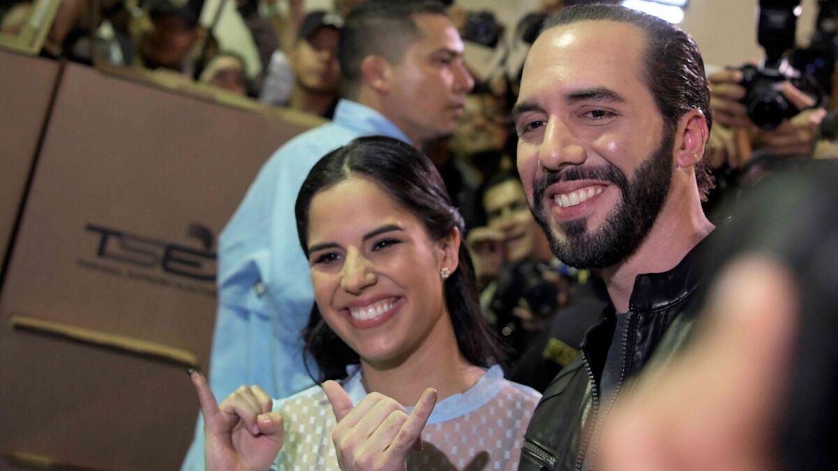 Salvadorean presidential candidate Nayib Bukele of the Great Alliance for National Unity and his wife, Gabriela Rodriguez, pose after voting during the Salvadorean presidential election in San Salvador on Feb. 3, 2019.