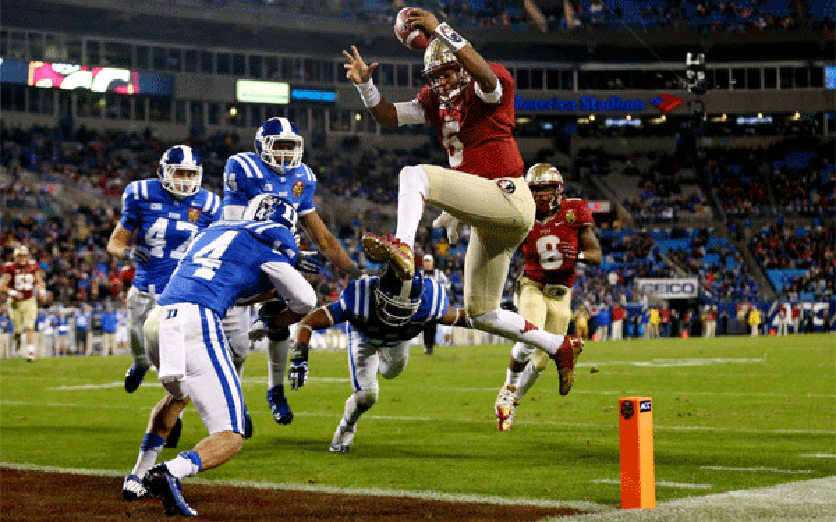 Florida state quarterback Jameis Winston rushes for a touchdown against Duke during the ACC championship game Saturday at Bank of America Stadium.