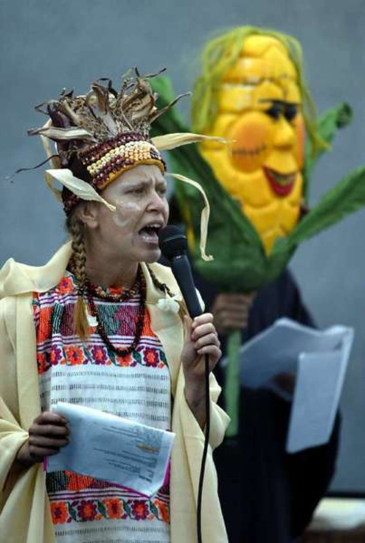 A protester in Sacramento speaks out against genetically modified corn.