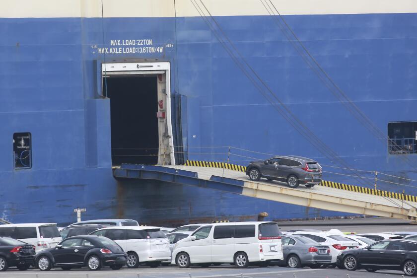 FILE - Cars for export are loaded onto a cargo ship at a port in Yokohama, on Nov. 2, 2021. Japan’s exports rose 7.8% in February, 2024, as shipments continued to expand in cars and electrical machinery, according to government data released Thursday, March 21, 2024.(AP Photo/Koji Sasahara, File)