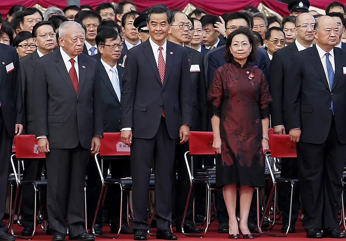 Hong Kong Chief Executive Leung Chun-ying, center, stands when the national anthem of China is played during a flag-raising ceremony in Hong Kong on Oct. 1.