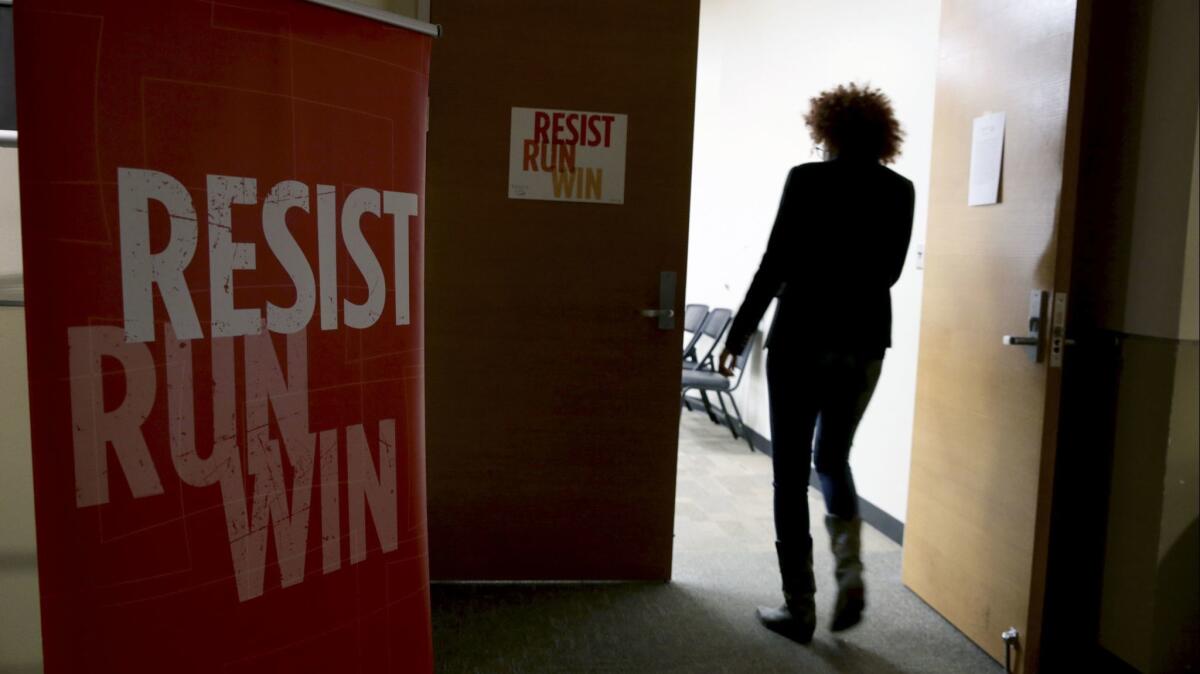 Signs direct participants to a women's candidate training workshop at El Centro College in Dallas.