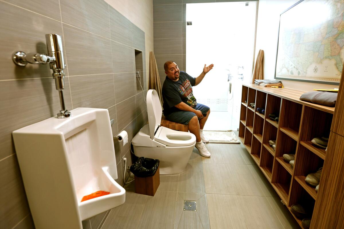 Actor and comedian Gabriel Iglesias inside his favorite room, the bathroom. He listens to Eagles playlists and enjoys a strong wifi signal in a room where he says he spends a lot of time.