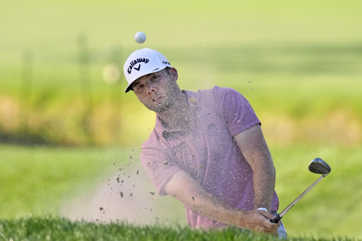 Sam Burns hits from the sand trap on the 16th hole during the first round of the Valspar Championship golf tournament Thursday, March 17, 2022, at Innisbrook in Palm Harbor, Fla. (AP Photo/Chris O'Meara)