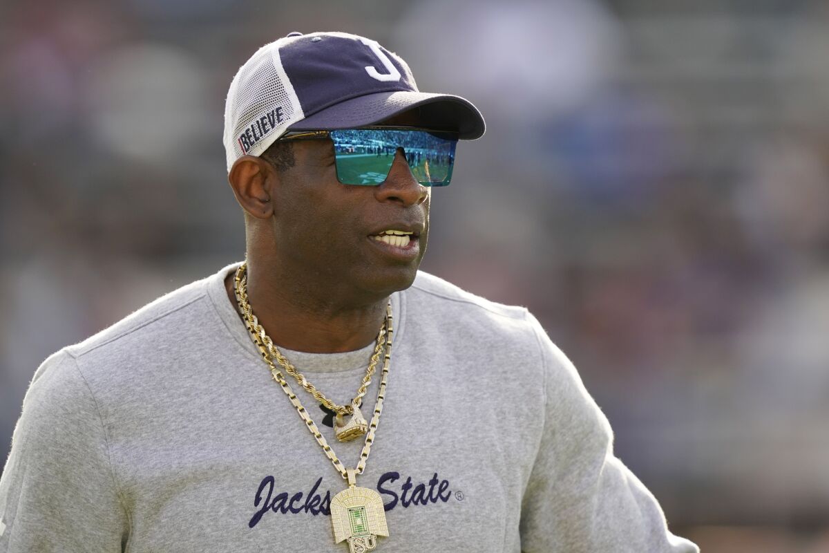 Deion Sanders watches his players warm up before a game between Jackson State and Southern University.