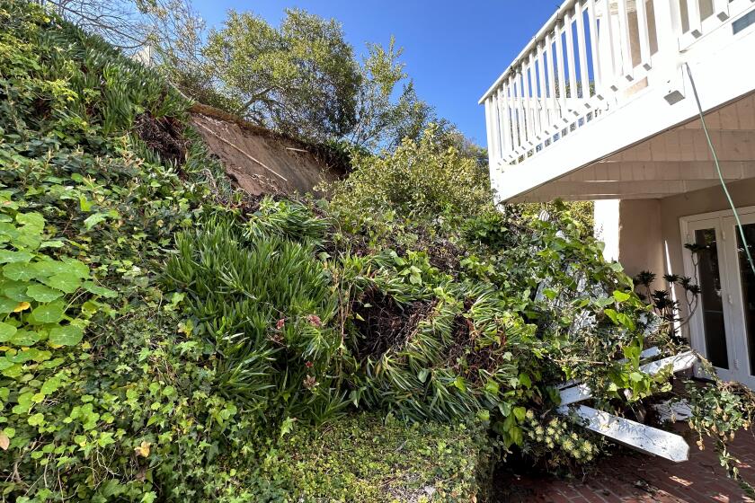 A mudslide to the back of a Via Capri property was believed to have been caused by a problematic concrete ditch on the other side of the hill, the homeowners say.