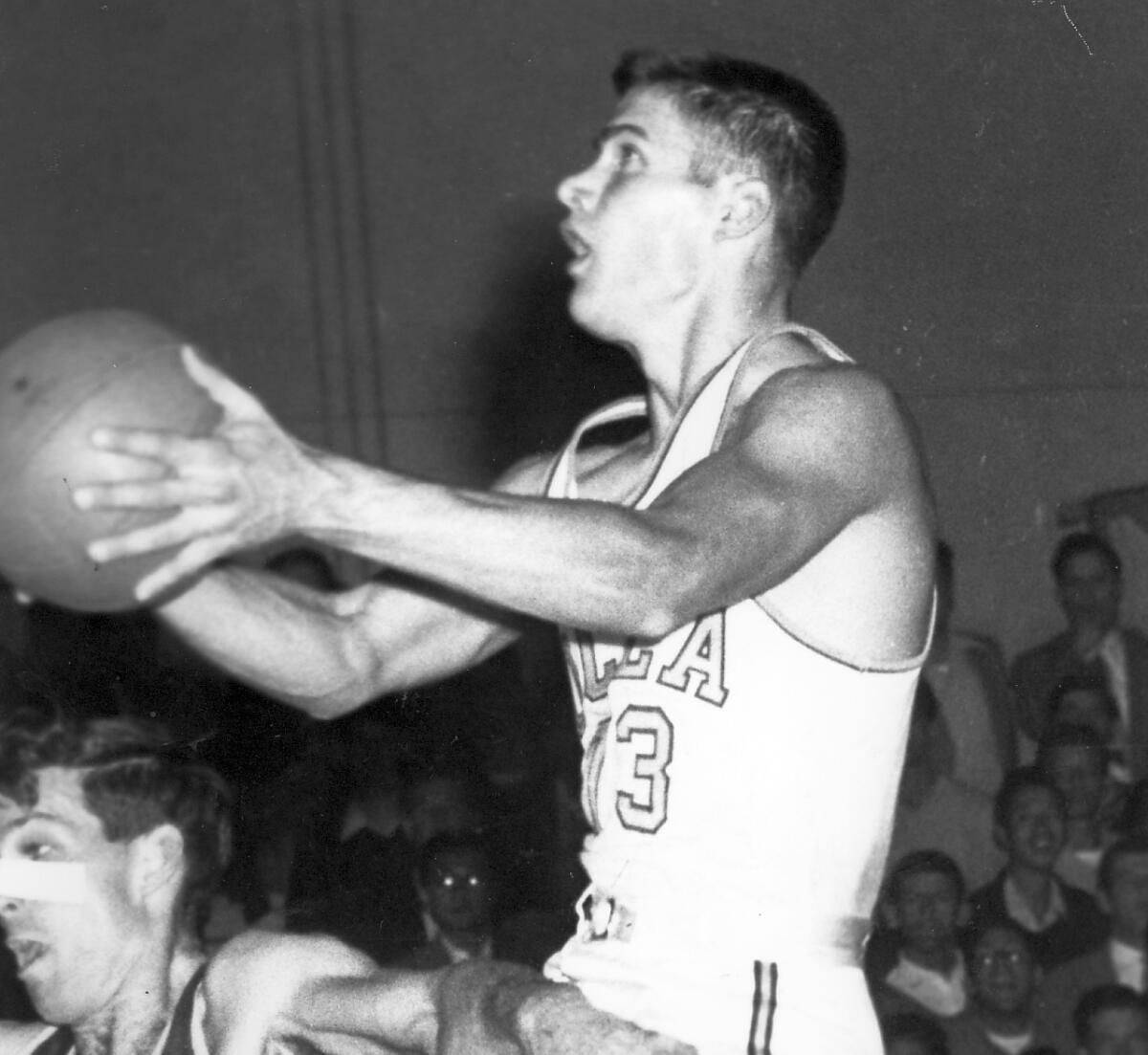 George Stanich drives to the basket in a game for UCLA.