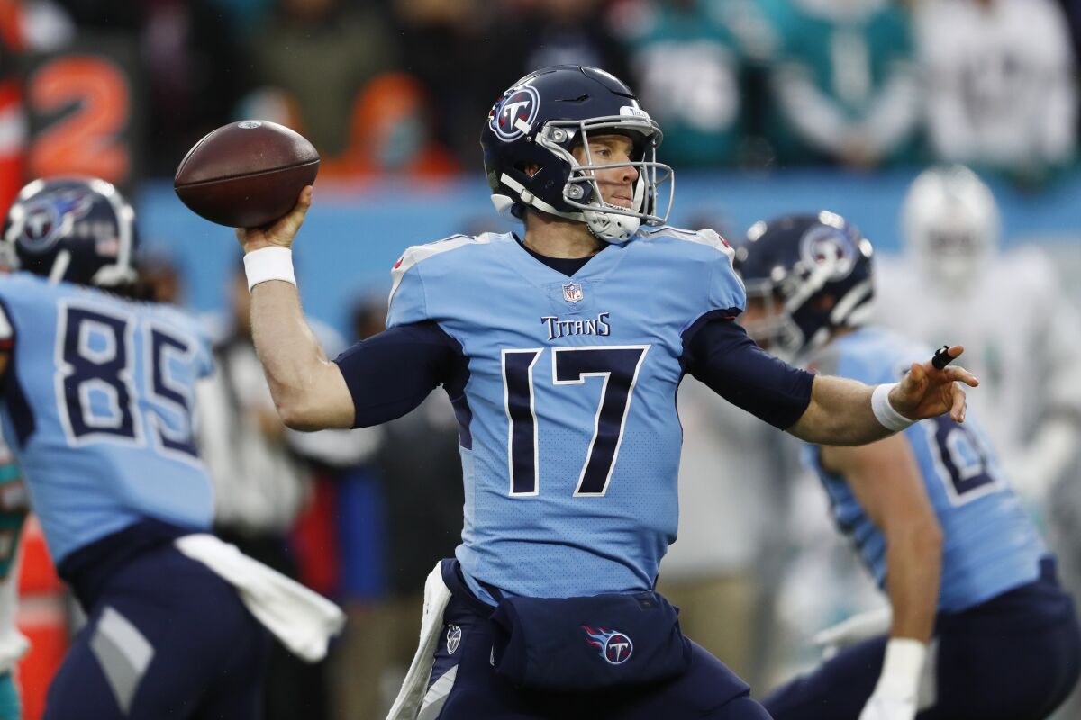 Tennessee Titans quarterback Ryan Tannehill (17) passes against the Miami Dolphins in the first half of an NFL football game Sunday, Jan. 2, 2022, in Nashville, Tenn. (AP Photo/Wade Payne)