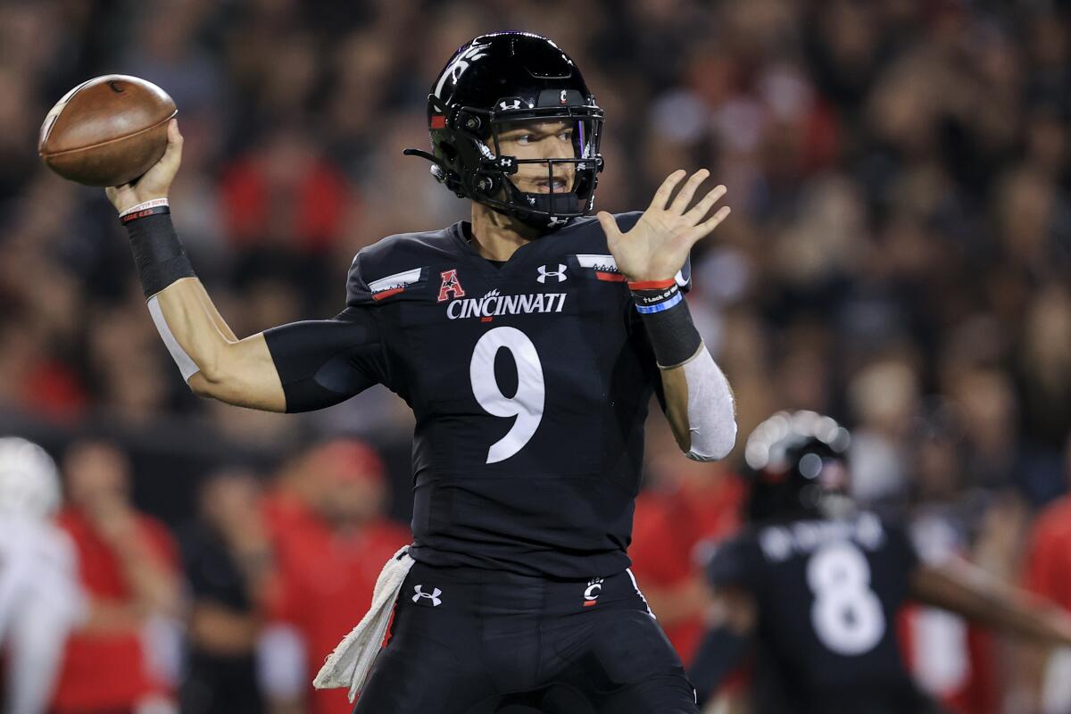 Quarterback Desmond Ridder of the Cincinnati Bearcats throws a