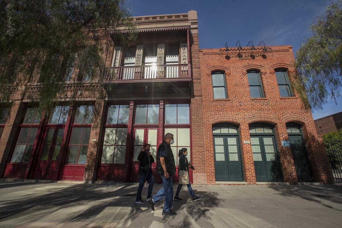 Pedestrians walk past the Chinese American Museum in downtown Los Angeles. 