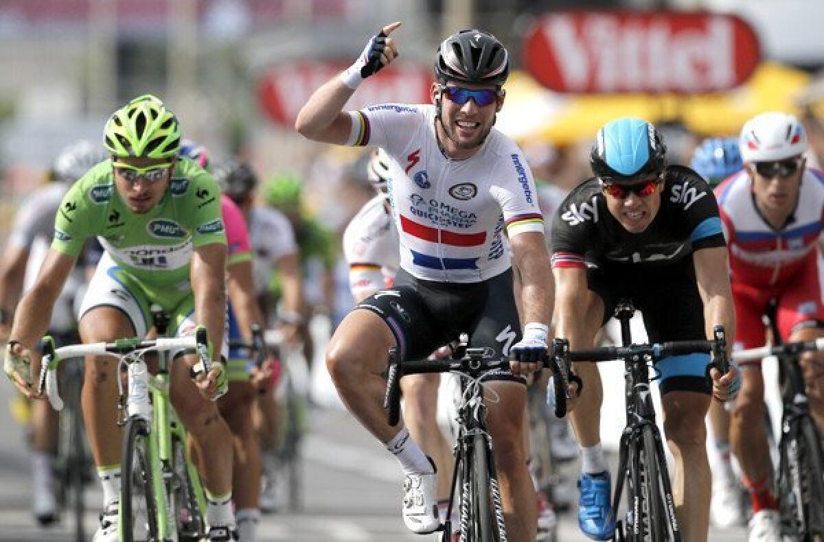 Britain's Marc Cavendish crosses the finish line ahead of Edvald Boasson Hagen of Norway and Peter Sagan of Slovakia to win the fifth stage of the Tour de France on Wedneseday in Marseille, France.