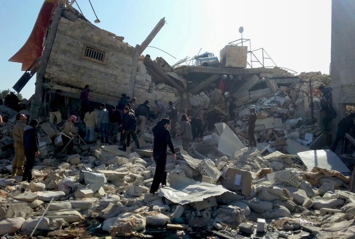 A picture released by Doctors Without Borders on Feb. 16 shows people gathering outside a hospital in Syria's northern province of Idlib a number of days after the building was hit by suspected Russian air strikes.