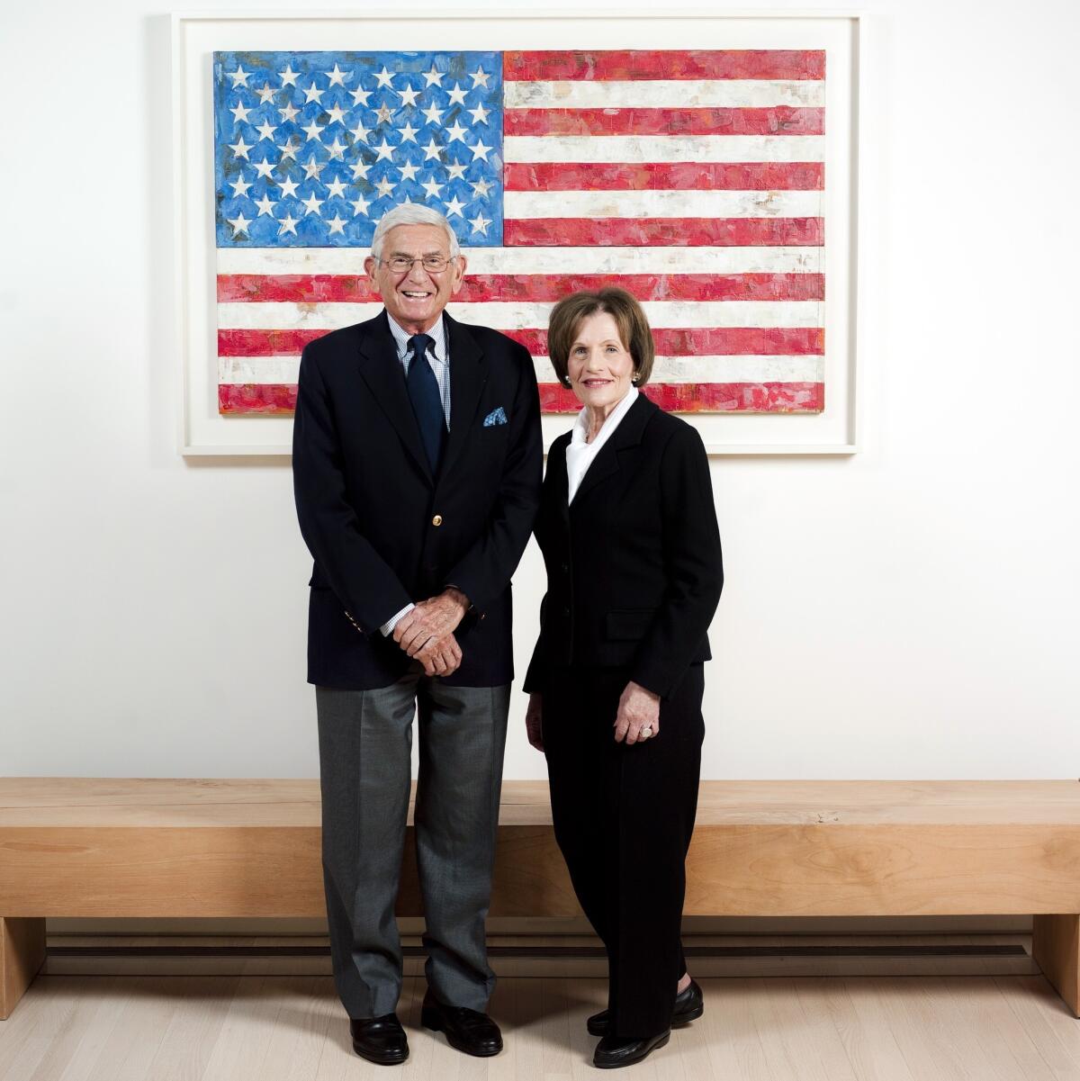 Philanthropists Eli and Edythe Broad are photographed in their Los Angeles home with an original Jasper Johns piece.
