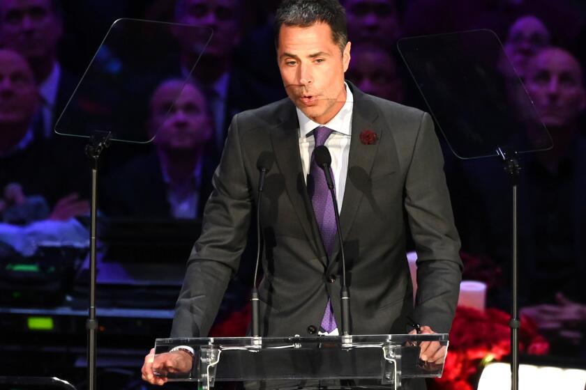 Lakers general manager Rob Pelinka spoke during the vigil of receiving a text from Kobe Bryant the morning of the crash, trying to arrange an internship for Lexi Altobelli, whose mother, father and sister died in the helicopter crash that also claimed the lives of Bryant and his daughter.