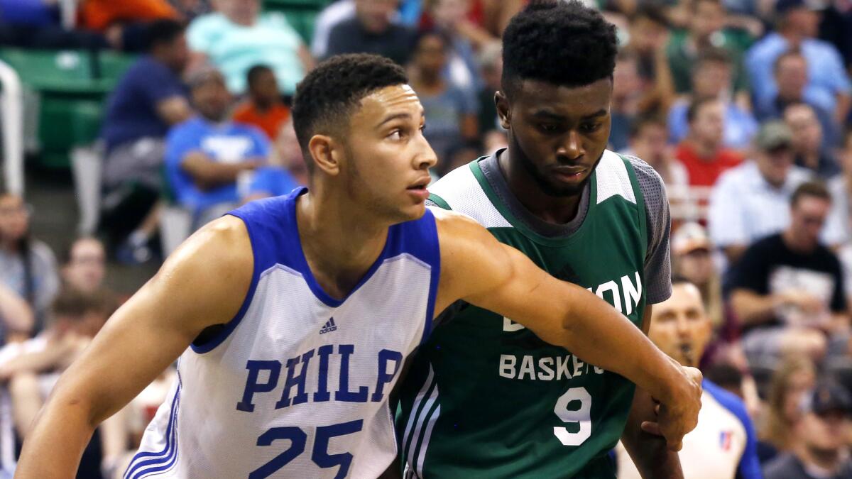 76ers rookie Ben Simmons (25) boxes out Celtic forward Jaylen Brown during an NBA Summer League game.