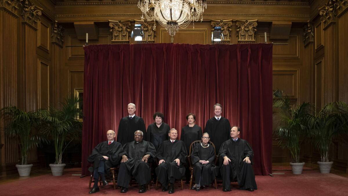 The Supreme Court justices gather for a group portrait on Nov. 30, 2018. Associate Justice Clarence Thomas is seated second from left.