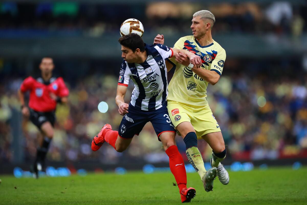 MEXICO CITY, MEXICO - DECEMBER 29: John Medina #33 of Monterrey struggles for the ball against Guido Rodríguez #05 of America during the Final second leg match between America and Monterrey as part of the Torneo Apertura 2019 Liga MX at Azteca Stadium on December 29, 2019 in Mexico City, Mexico. (Photo by Hector Vivas/Getty Images) ** OUTS - ELSENT, FPG, CM - OUTS * NM, PH, VA if sourced by CT, LA or MoD **