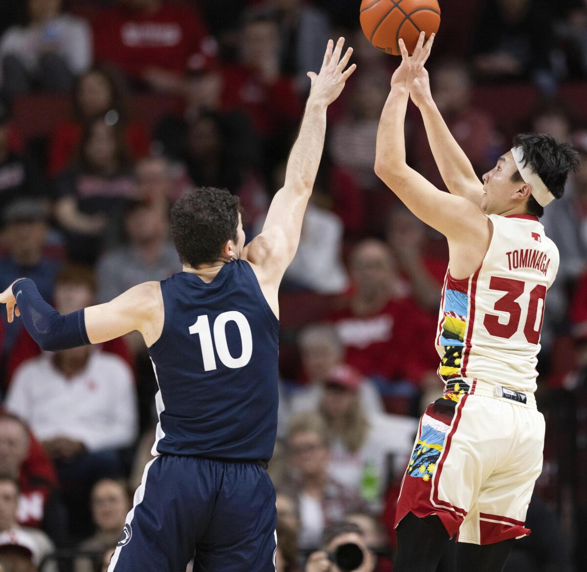 Nebraska's Keisei Tominaga (30) shoots a 3-point basket against Penn State's Andrew Funk (10) during the second half of an NCAA college basketball game Sunday, Feb. 5, 2023, in Lincoln, Neb. (AP Photo/Rebecca S. Gratz)
